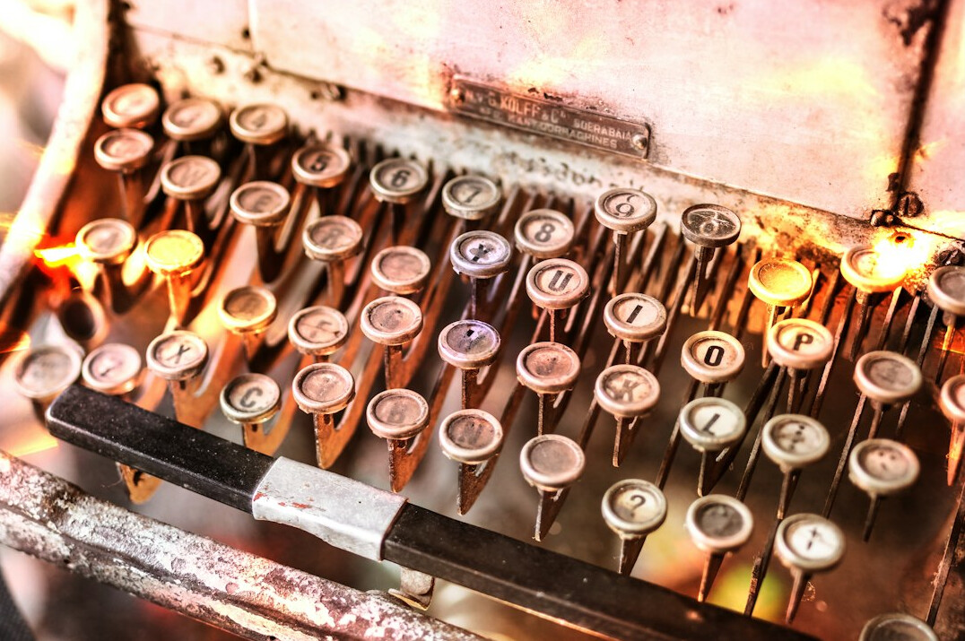 Vintage typewriter with a letter on a wooden desk