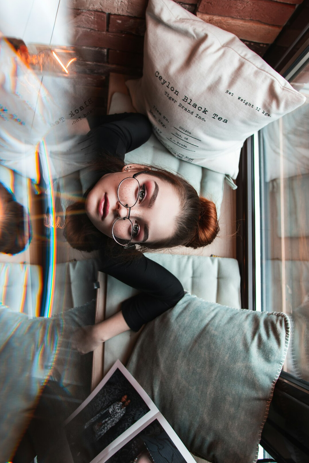 Woman editor with glasses working on a laptop
